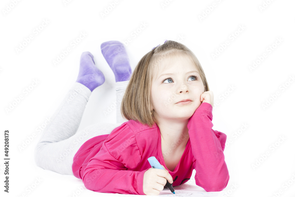 Little blonde girl writing