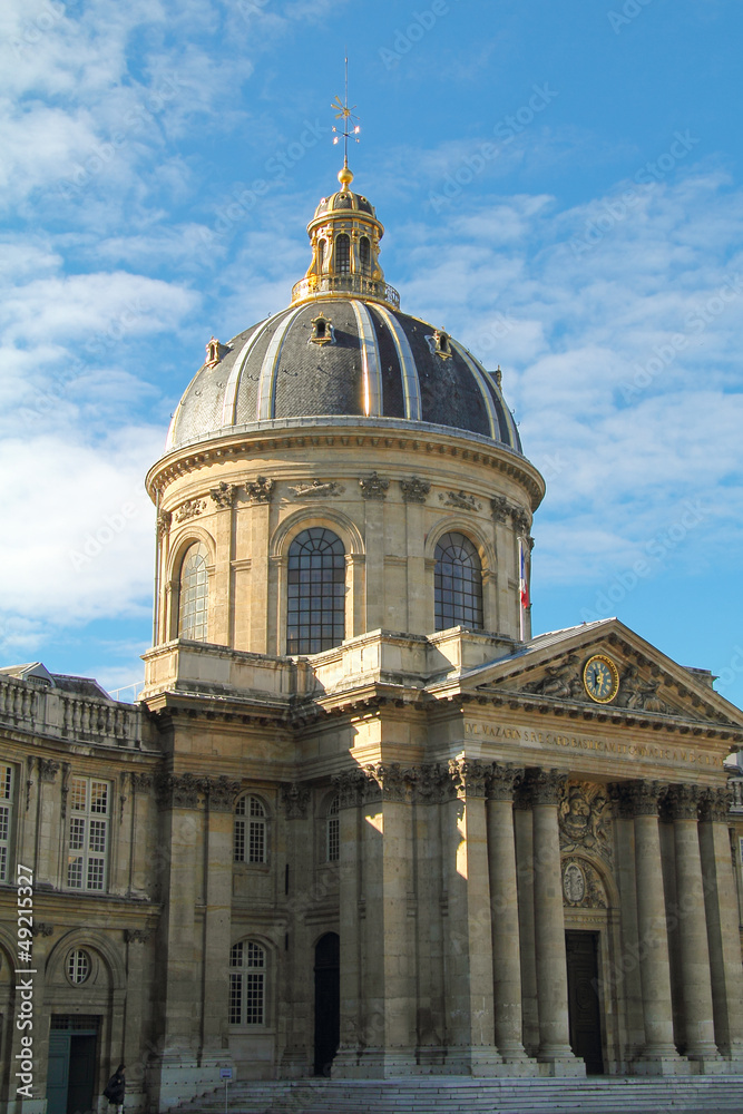 Institut de France , golden dome against a cloudy blue sky