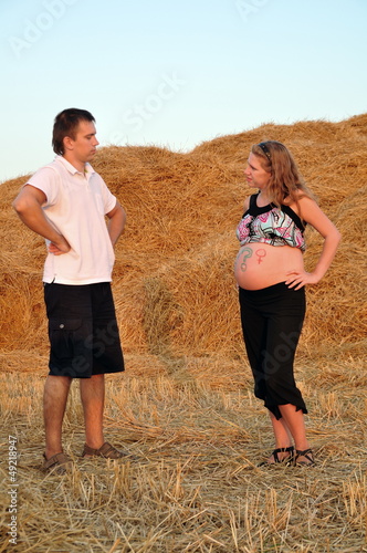 The pregnant girl and the guy on a mow