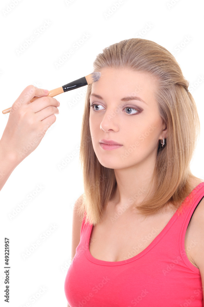beautiful woman with make-up brush