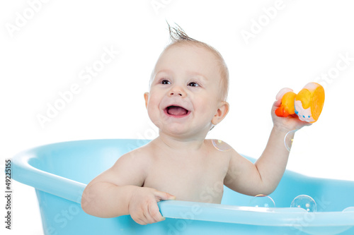 baby kid taking bath and pl...