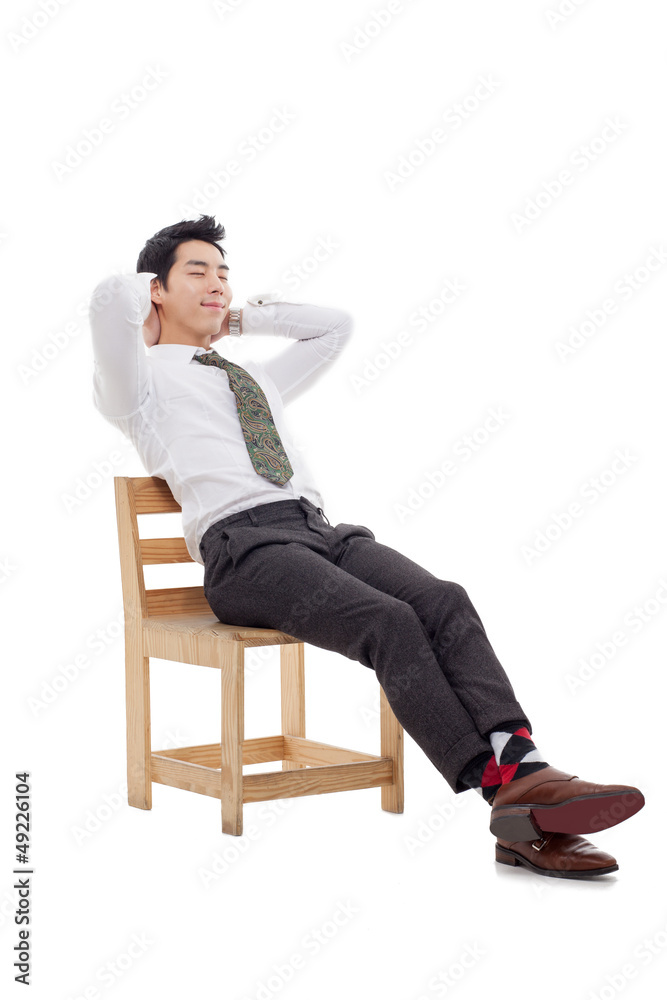 Young Asian business man sitting on the chair Young Asian business man sitting on the chair