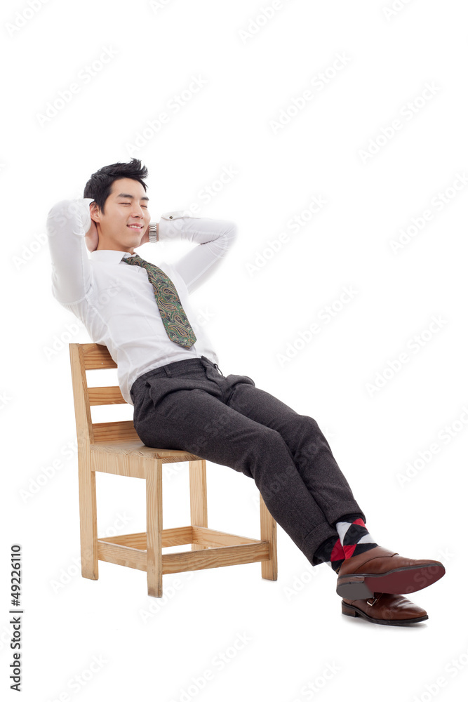 Young Asian business man sitting on the chair Young Asian business man sitting on the chair