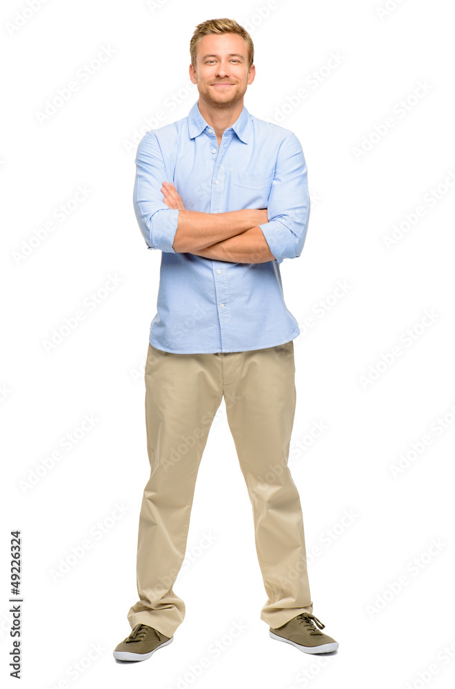 Handsome young man arms folded full length white background Handsome young man arms folded full length white background