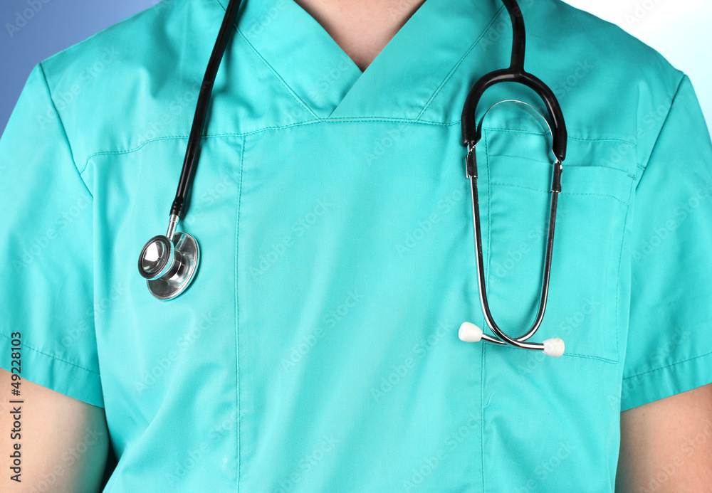 Doctor with stethoscope, on blue background Doctor with stethoscope, on blue background