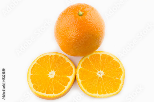 Whole orange fruit and his segments or cantles isolated on white