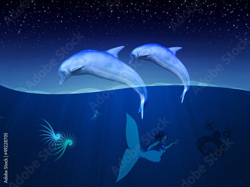 Underwater dolphins and mermaid