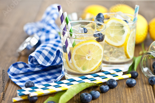 Homemade lemonade with lemons and blueberries photo