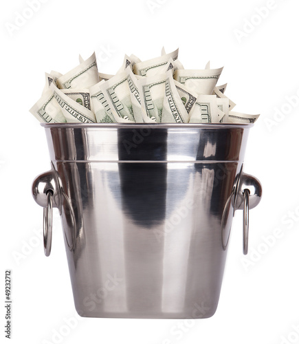 Bucket with money on white background photo