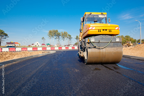 Road roller during asphalt paving works photo