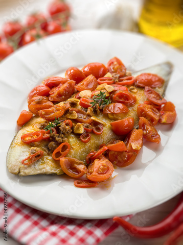 sole fish with tomato anchovy and hot chili pepper, selective fo
