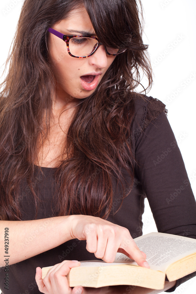 young and graceful girl reading a book and wearing big glasses young and graceful girl reading a book and wearing big glasses