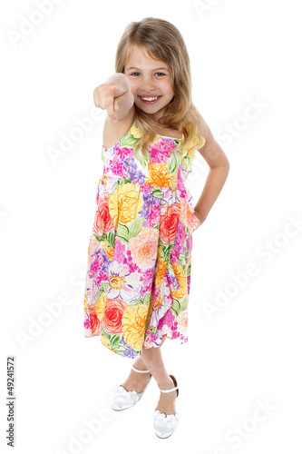 Charming young child pointing at you