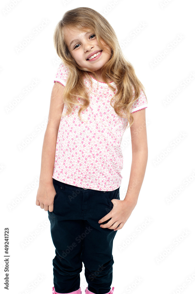 Shy young girl posing in trendy casuals Shy young girl posing in trendy casuals