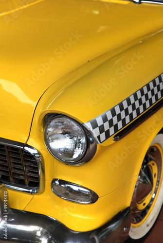 Yellow classic car taxi close up shot