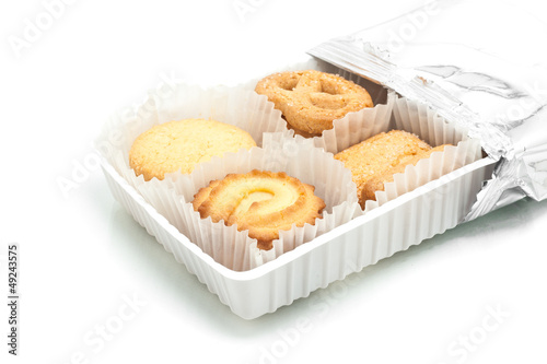 Assorted cookie in plastic box , isolated on white