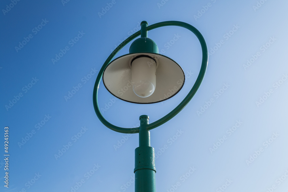 A green street lamp A green street lamp