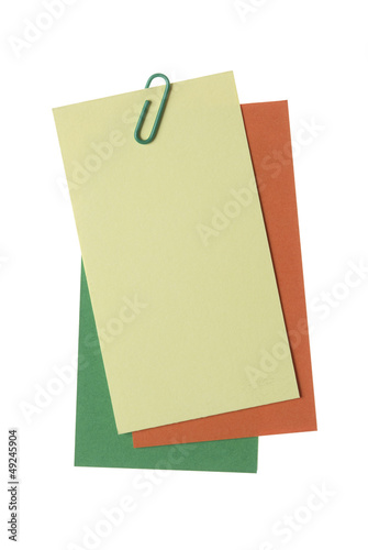 Paper notes with clip isolated on white