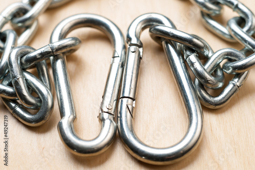 Carabiners and Chain on Wooden Table