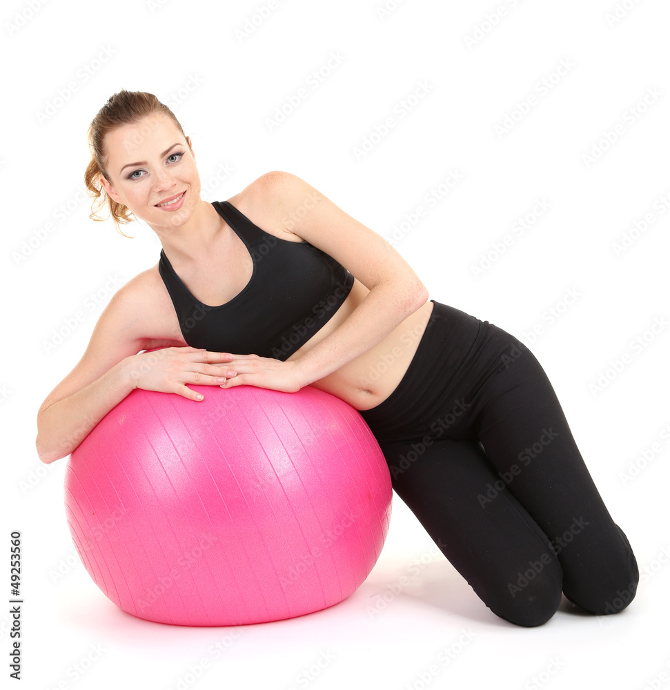 Young woman doing fitness exercises with gym ball isolated Young woman doing fitness exercises with gym ball isolated
