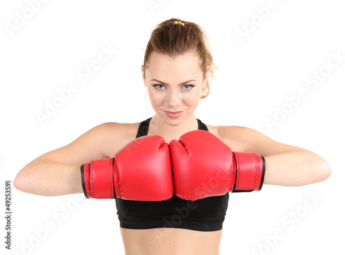Young beautiful woman with boxing gloves at workout isolated © Africa Studio