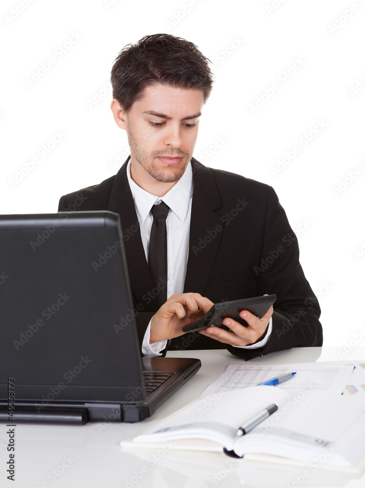Young accountant making calculations Young accountant making calculations