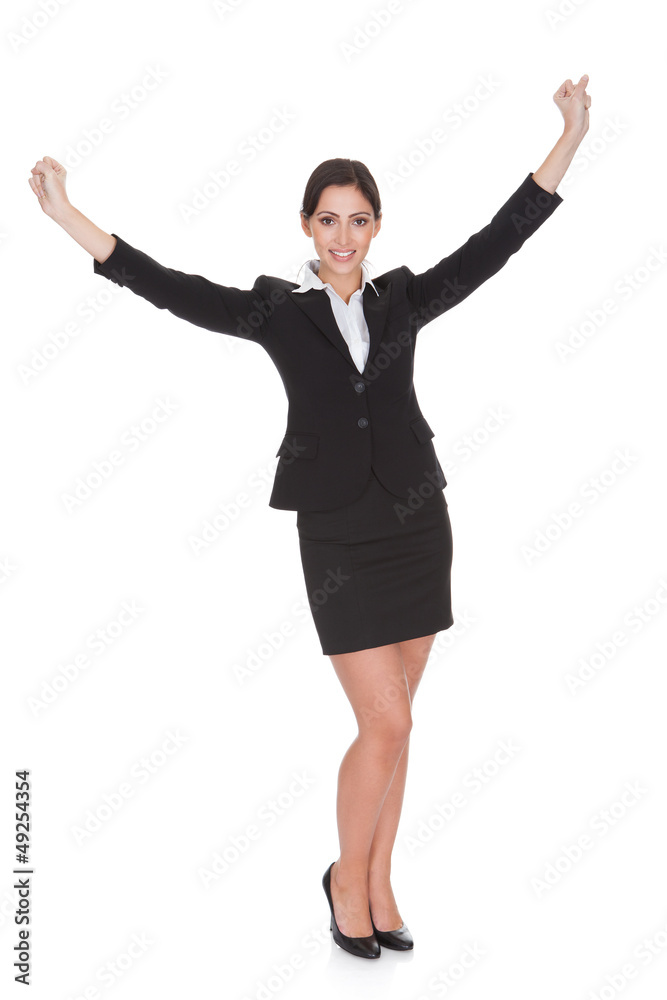 Businesswoman Celebrating With Hand Raised Businesswoman Celebrating With Hand Raised