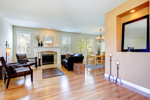 Living room inteior with fireplace and hardwood floor.