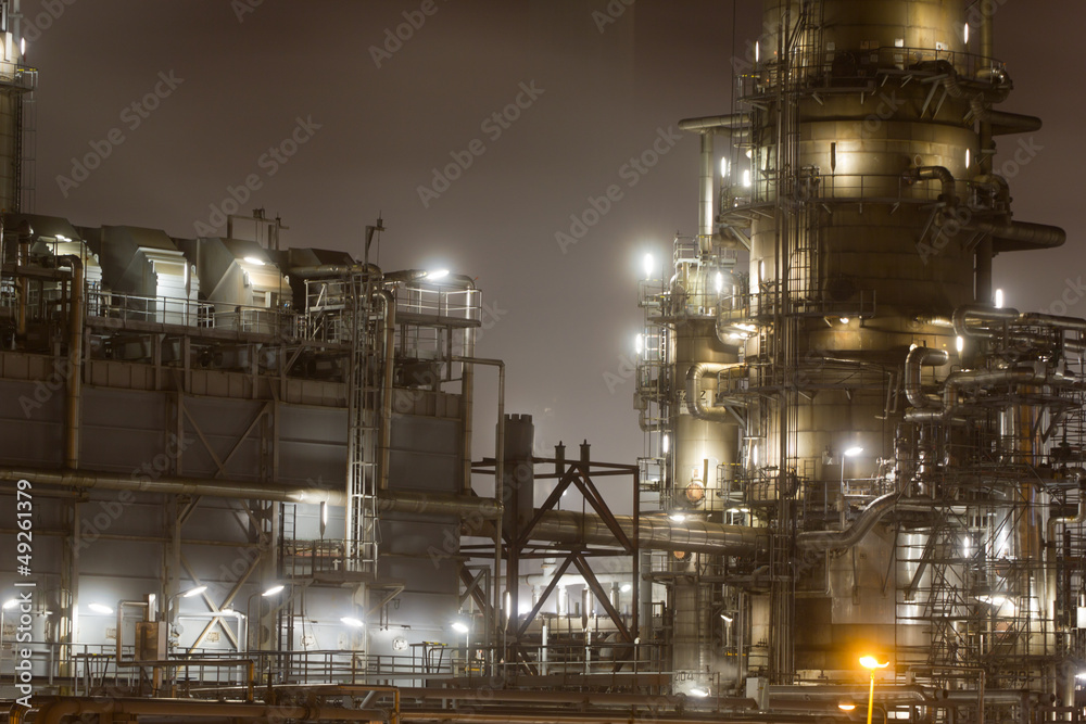 Close-up of a large oil-refinery plant at night