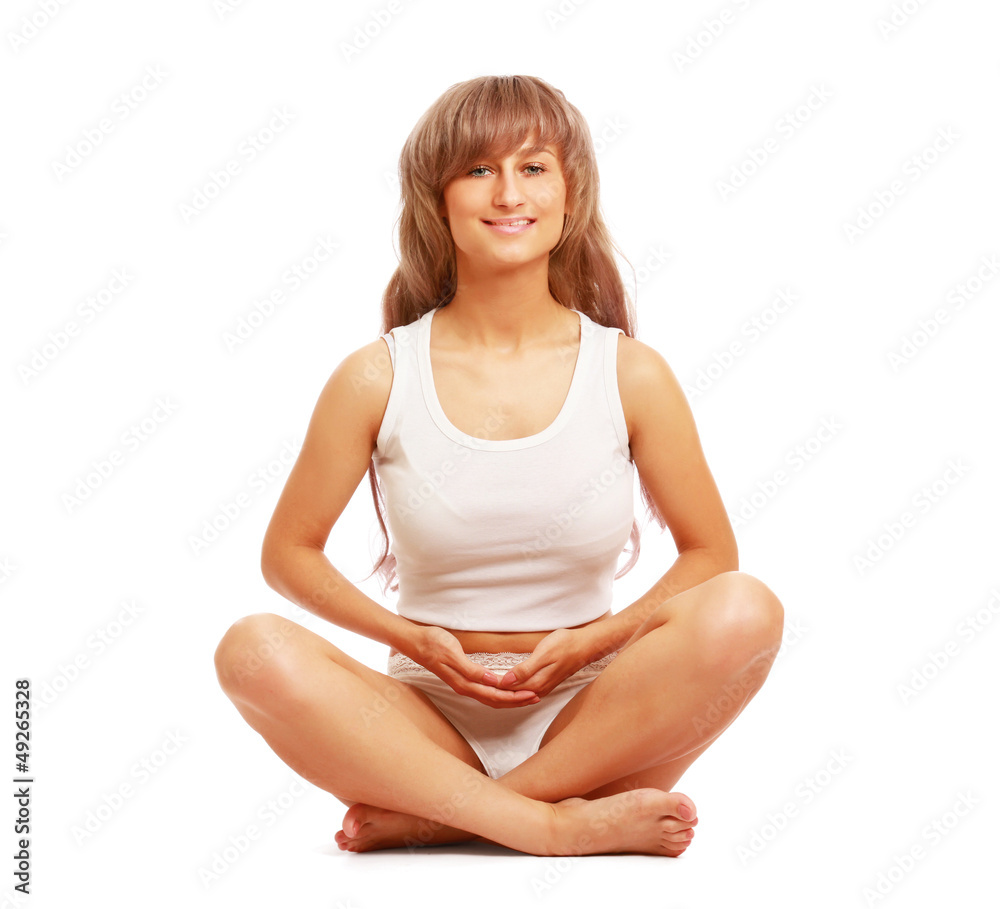 A lotus position in practise of yoga - on white background A lotus position in practise of yoga - on white background
