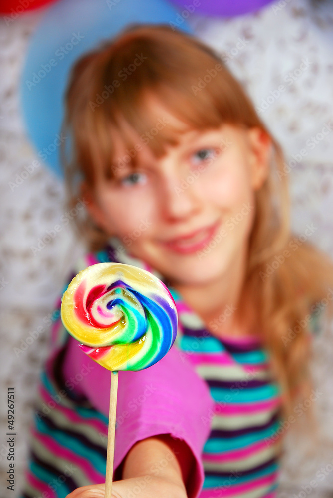 young girl with lollipop