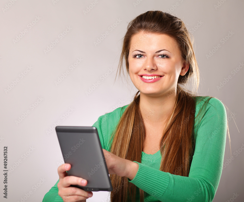 Young woman sitting on the desk with computer plane-table Young woman sitting on the desk with computer plane-table