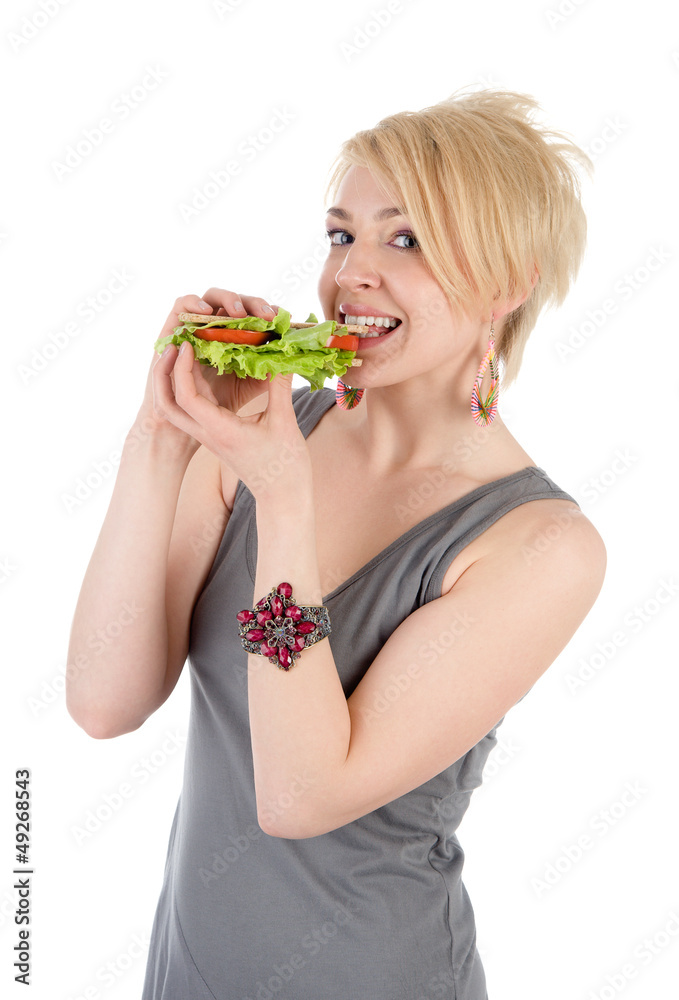 Pretty young lady eating sandwich. isolated on white Pretty young lady eating sandwich. isolated on white