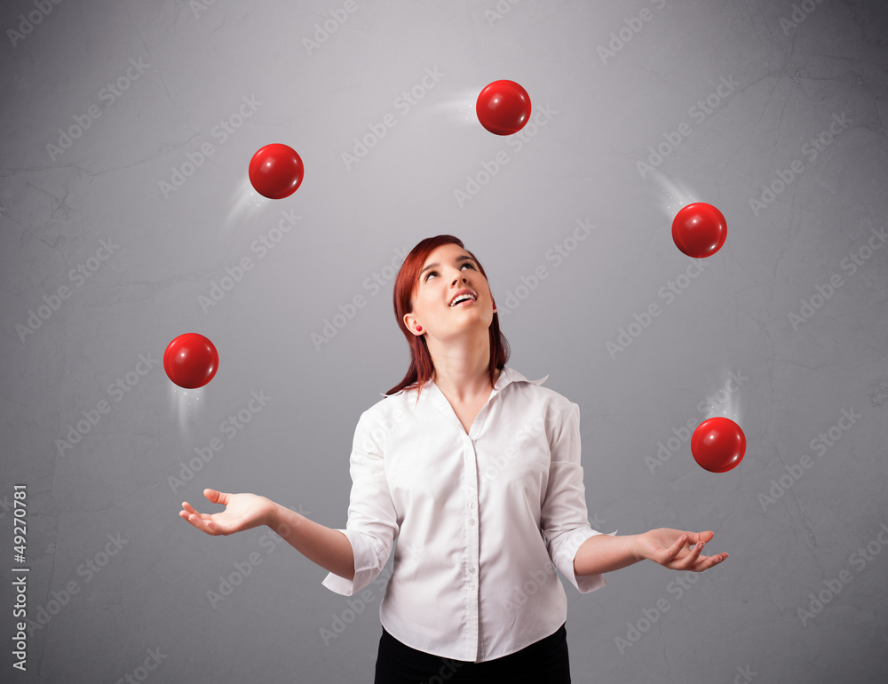young girl standing and juggling with red balls - obrazy, fototapety, plakaty 