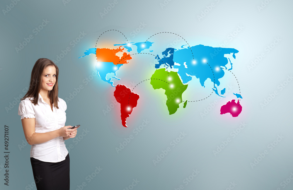 Young woman holding a phone and presenting colorful world map Young woman holding a phone and presenting colorful world map