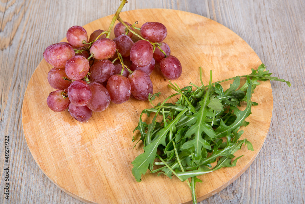 Fresh rucola salad with red grapes Fresh rucola salad with red grapes