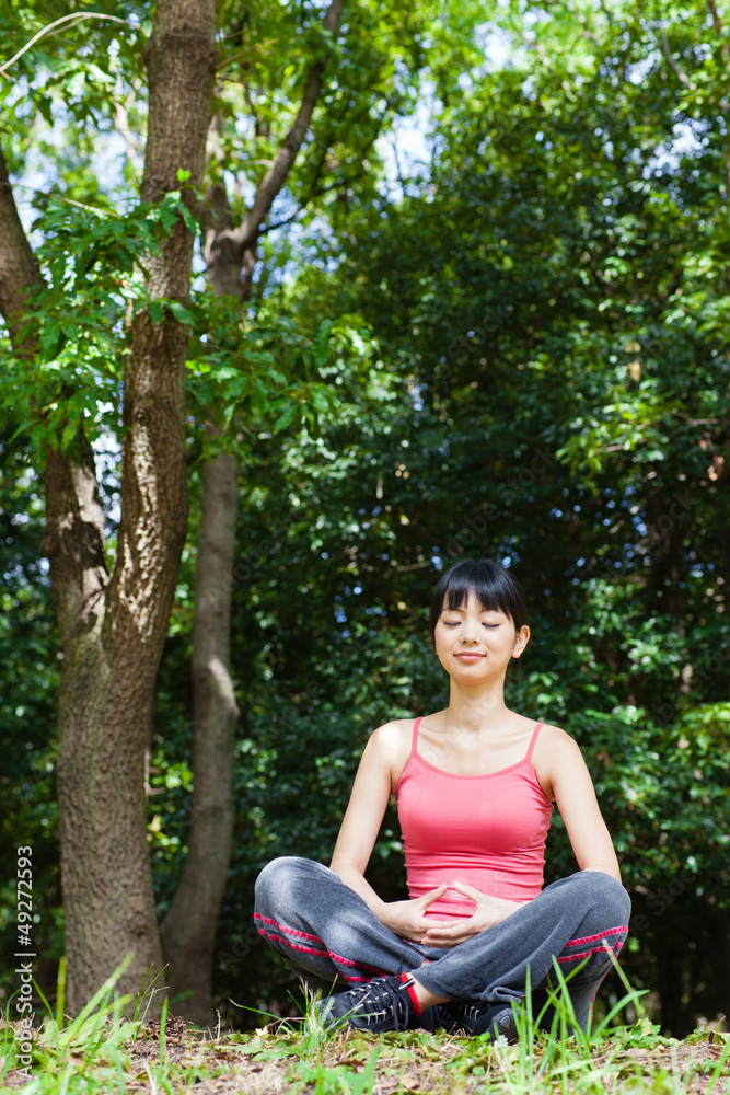 attractive asian woman relaxing in the park attractive asian woman relaxing in the park