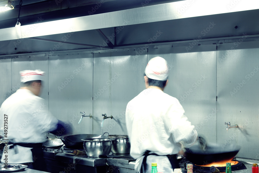 motion chefs of a restaurant kitchen