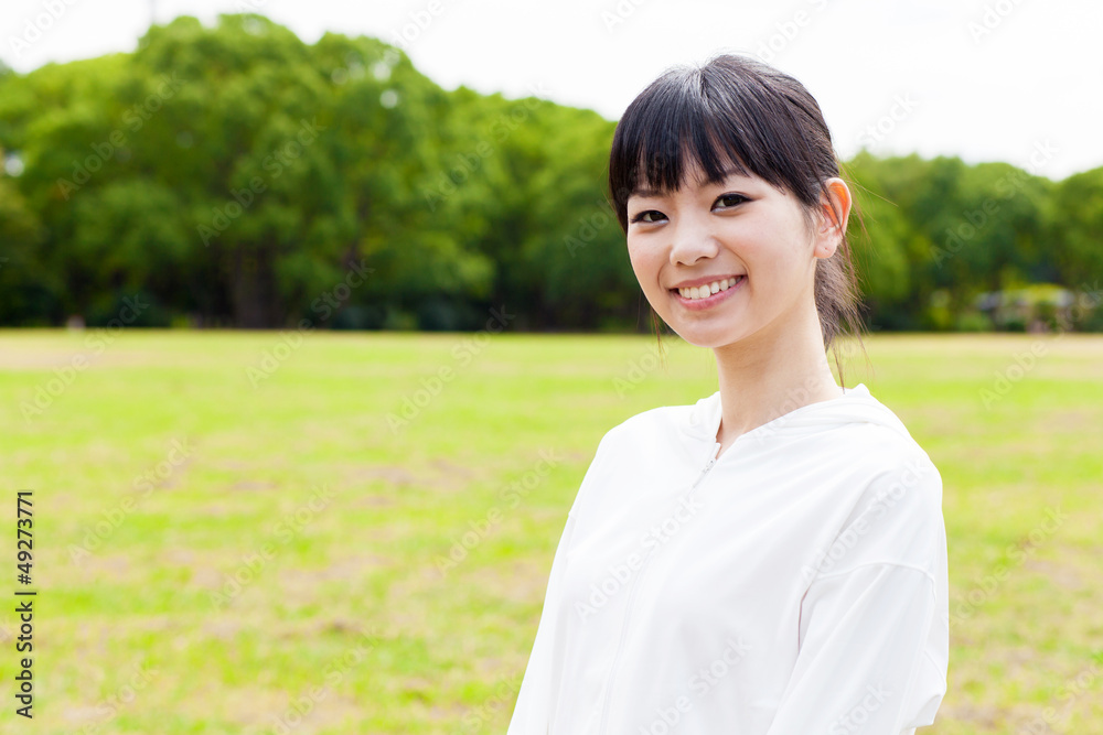 attractive asian woman relaxing in the park attractive asian woman relaxing in the park