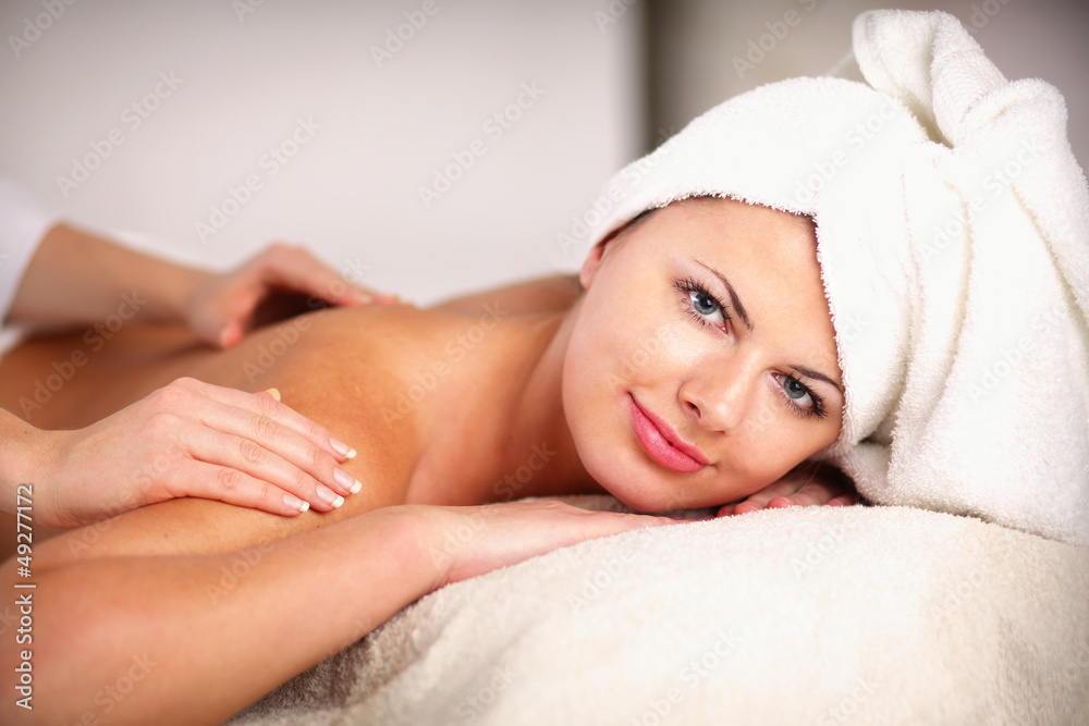 Closeup of an attractive young woman receiving massage Closeup of an attractive young woman receiving massage