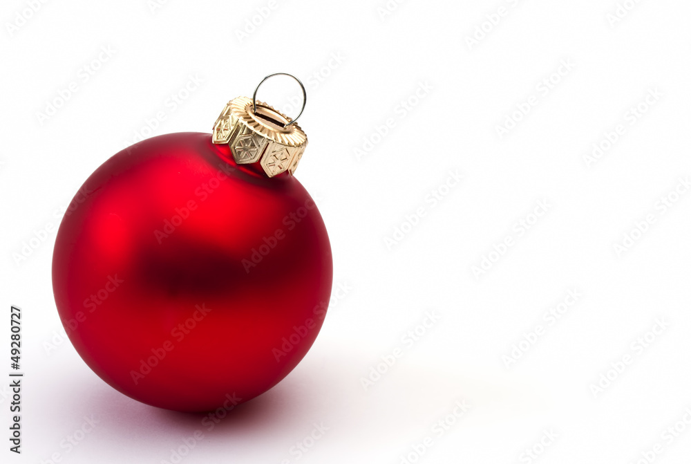 Red christmas bauble on a white background Red christmas bauble on a white background