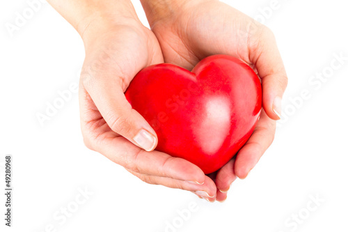 Heart in hands as love and health symbol