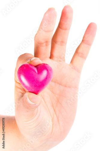 Heart in hand as love and health symbol