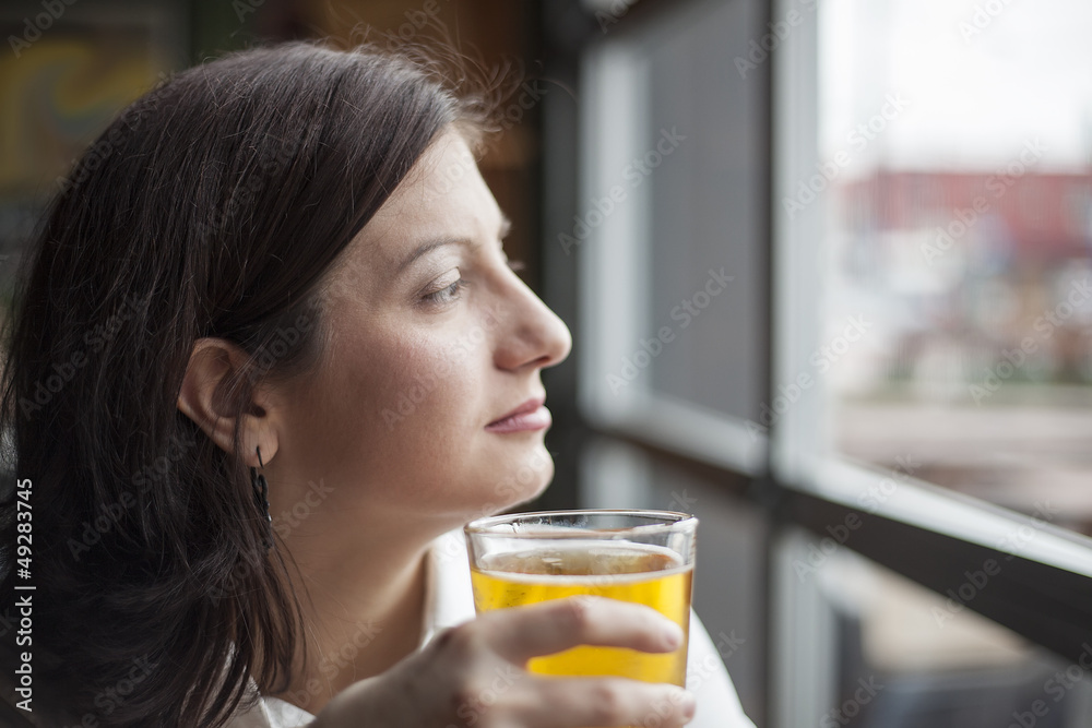 Young Woman Drinking a Pint of Hard Cider Young Woman Drinking a Pint of Hard Cider