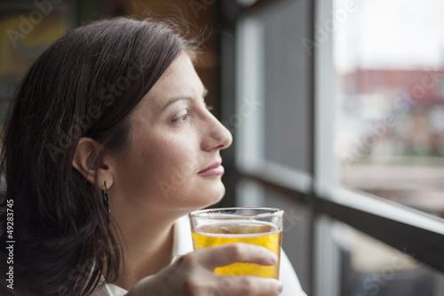 Young Woman Drinking a Pint of Hard Cider