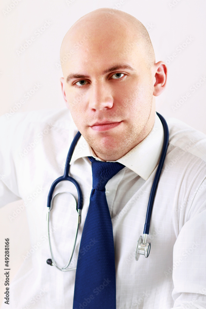 A male doctor , isolated on white background A male doctor , isolated on white background