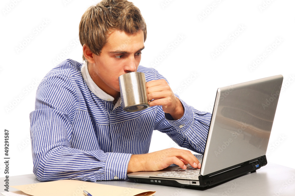 handsome young man working with laptop handsome young man working with laptop