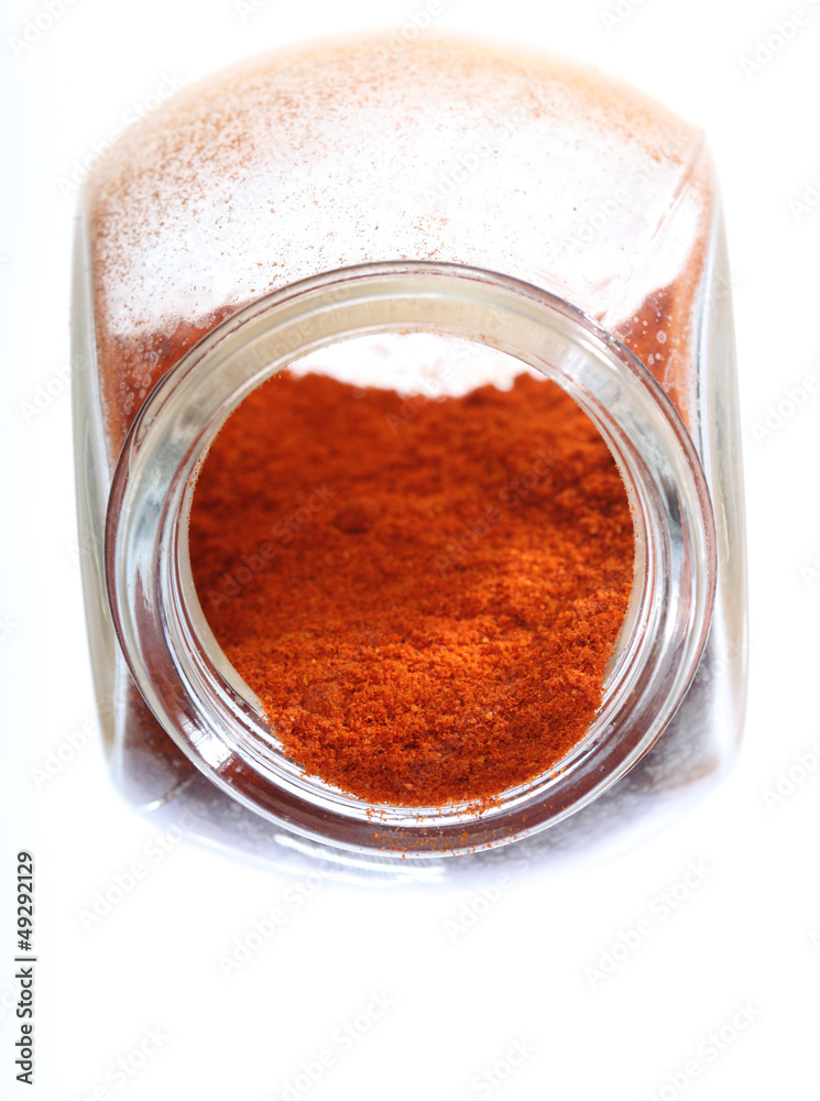 Close up jar with paprika spice isolated Close up jar with paprika spice isolated