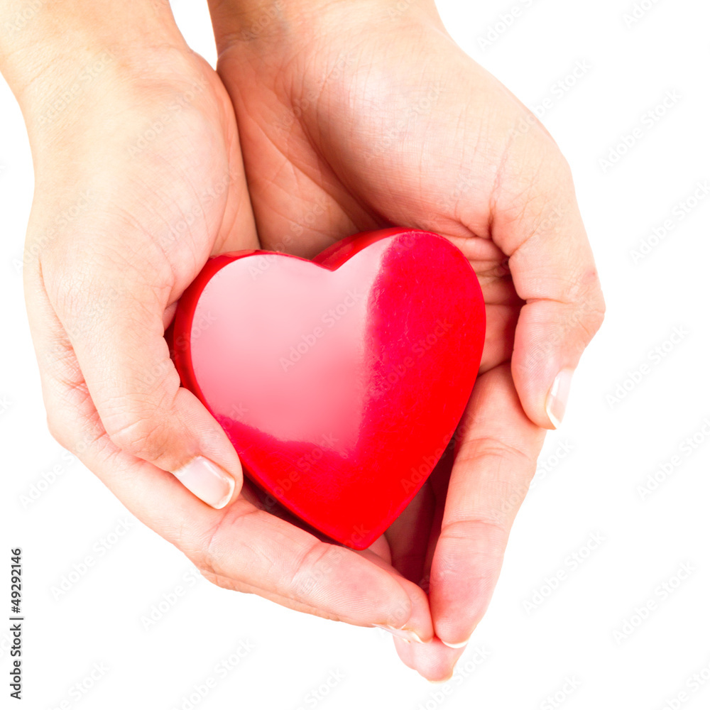 Heart shape in hands as love symbol