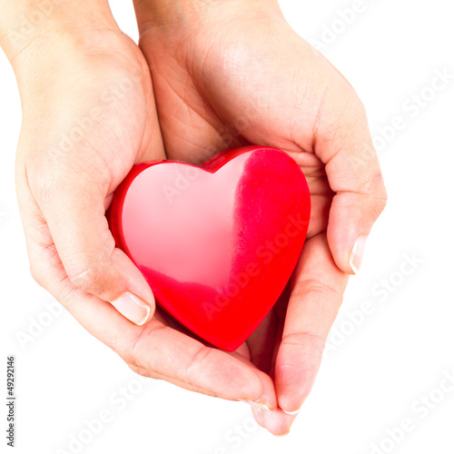 Heart shape in hands as love symbol